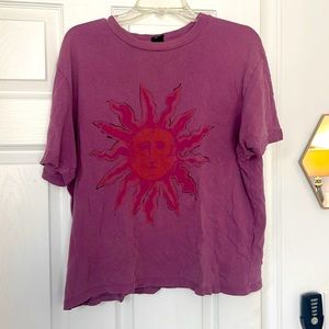 Oversized magenta Sun graphic T-shirt.